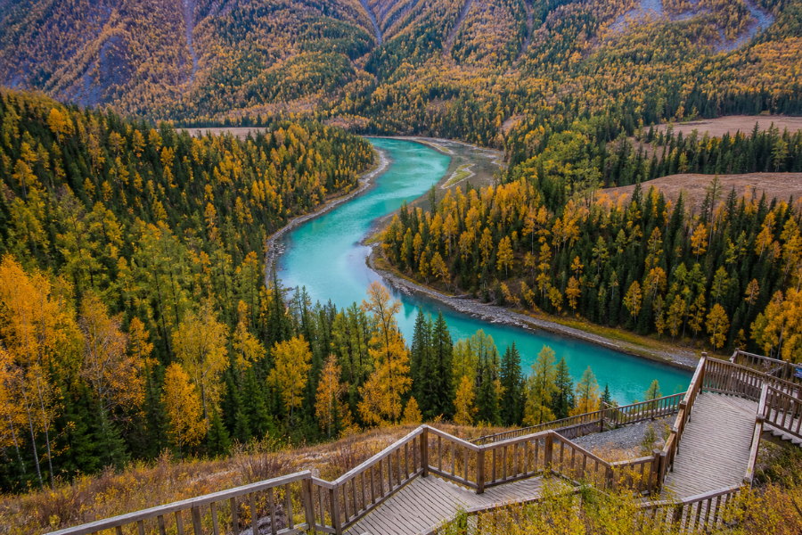 Moon Bay in Kanas Lake Scenic Area with forest river bend