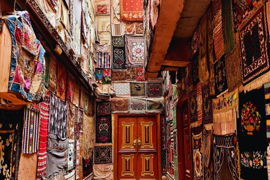 Travelers experiencing Silk Road culture in Kashgar ancient city reflecting Year of the Goat cultural journey Travelers experiencing Silk Road culture in Kashgar ancient city reflecting Year of the Goat cultural journey